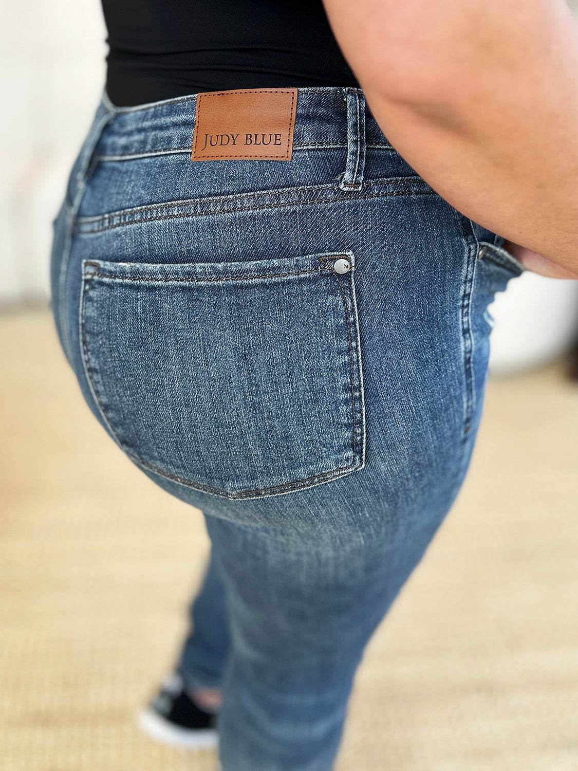 Judy Blue Full Size Mid Waist Distressed Slim Jeans - UnLaced Boutique